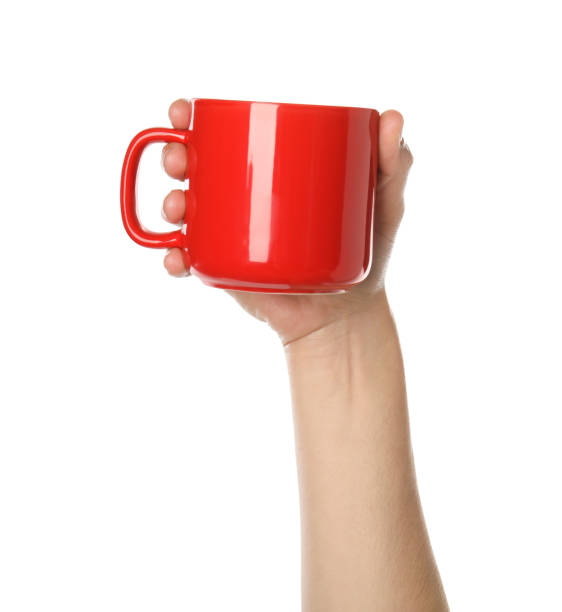 istock Woman holding red cup on white background, closeup 1349348542