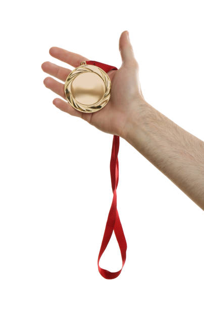 istock Man holding golden medal on white background, closeup. Space for design 1349348590