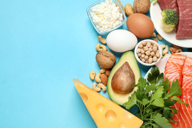 istock Different products rich in protein on light blue background, flat lay. Space for text 1349349668