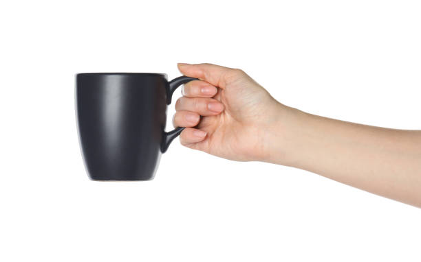 istock Woman holding black cup on white background, closeup 1349353218