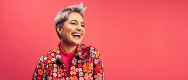 istock Cheerful hipster woman smiling in a studio 1349353436