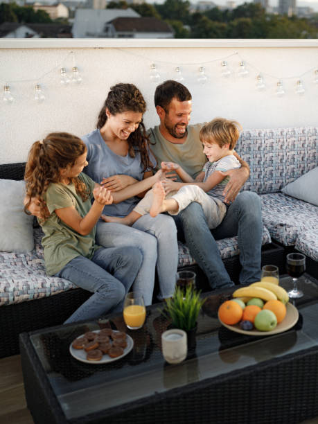 istock Cheerful family having fun on a patio at roof. 1349355001