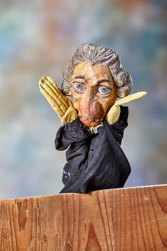 Vintage hand puppet from the 1930s, the gray haired senior man arguing