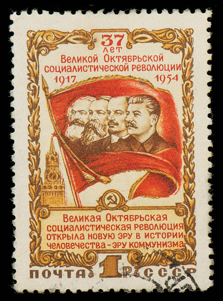 Soviet stamp with Marx, Engels, Lenin and Stalin Soviet Russian postage stamp from 1954 released for the 37th anniversary of Great Socialist October Revolution in 1917. The stamp has a drawing of Marx, Engels, Lenin and Stalin on a red flag. vladimir lenin photos stock pictures, royalty-free photos & images