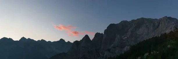 panorama of the Julian Alps at sunrise from paving stone corner of Vrsic-Pass, Slovenia