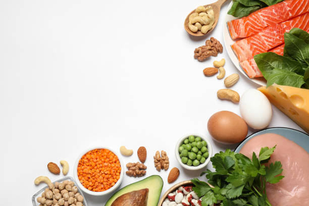 istock Different products rich in protein on white background, flat lay 1349356047