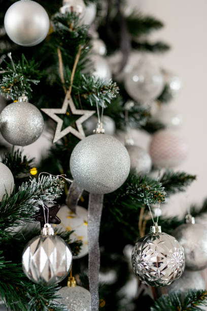 istock Christmas tree decorated with beautiful balloons and ribbons. Artificial spruce with decorative toys. Concept - Christmas weekend 1349356509