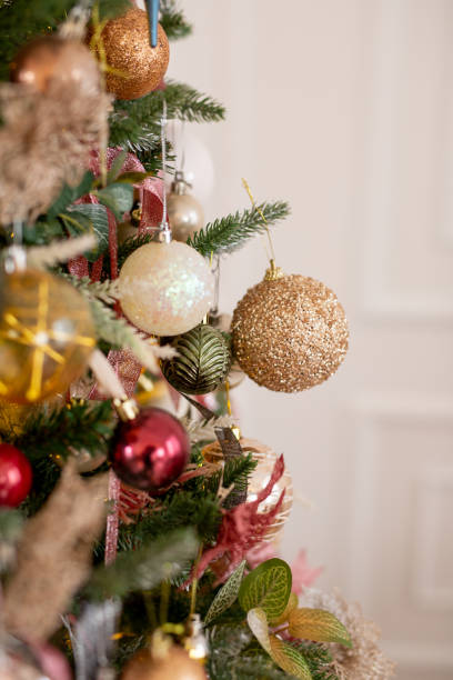 istock Christmas tree decorated with beautiful balloons and ribbons. Artificial spruce with decorative toys. Concept - Christmas weekend 1349356639