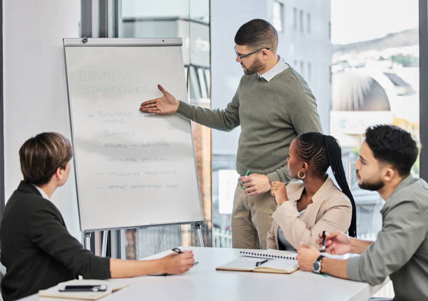istock Shot of a businessman delivering a presentation at work 1349356729