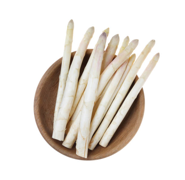 istock Fresh ripe asparagus in bowl isolated on white, top view 1349357488