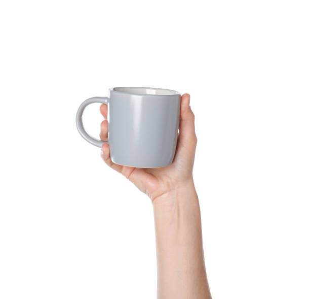 istock Woman holding grey cup on white background, closeup 1349359105