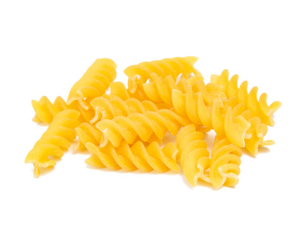 istock Italy uncooked spiral pasta isolated on the white background 1349360368