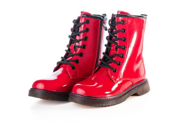 Shiny leather shoes. Shining boots isolated. Shiny leather shoes. Shining boots isolated. red boot stock pictures, royalty-free photos & images