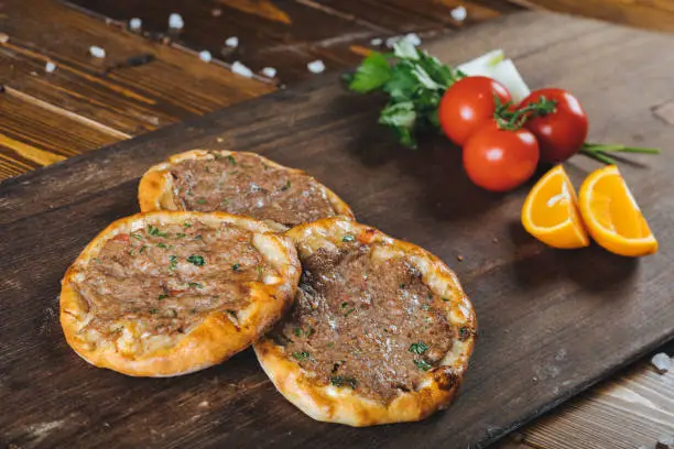 Traditional Turkish pide with minced beef. Meaty Pita, thin piece of dough topped with minced meat. cooked in stone furnace. Nazilli , Aydin