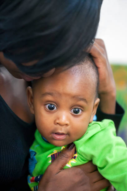 istock African mother holding her child 1349365045