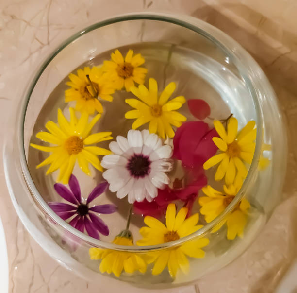 istock Decoration fresh flowers in a water glass 1349367692