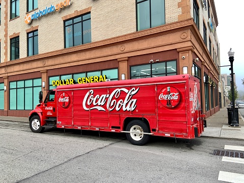 Pittsburgh, USA     October 1, 2021\nCoca Cola delivery truck parked in front of Dollar General Store in Pittsburgh’s  East Liberty.