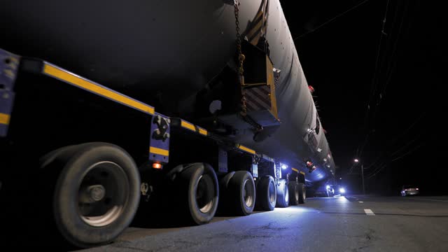 Overnight delivery of oversized cargo. A giant steel tank for the oil industry