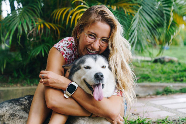 istock Young Woman With Her Dog 1349370035