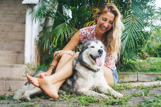 istock Young Woman With Her Dog 1349371763