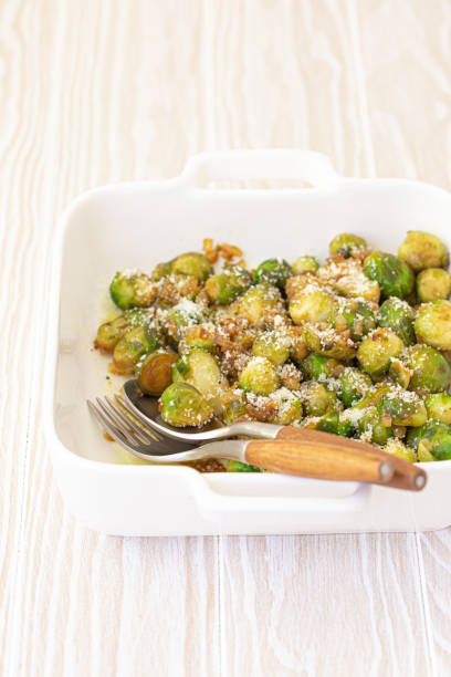 istock Vegetarian roasted brussels sprouts on white table 1349372092