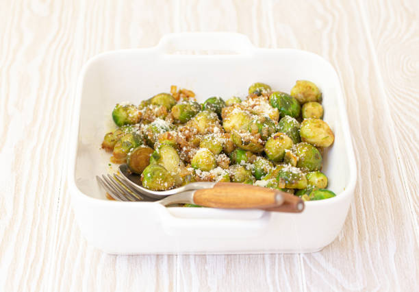 istock Vegetarian roasted brussels sprouts on white table 1349372093