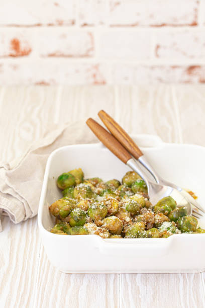 istock Vegetarian roasted brussels sprouts on white table 1349372098