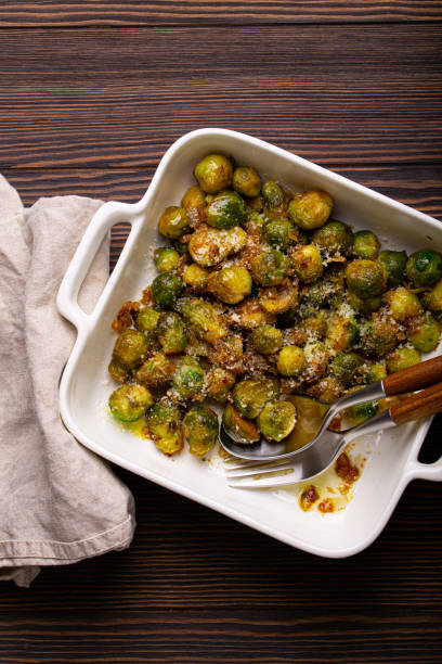 istock Vegetarian roasted brussels sprouts on wooden table 1349372101