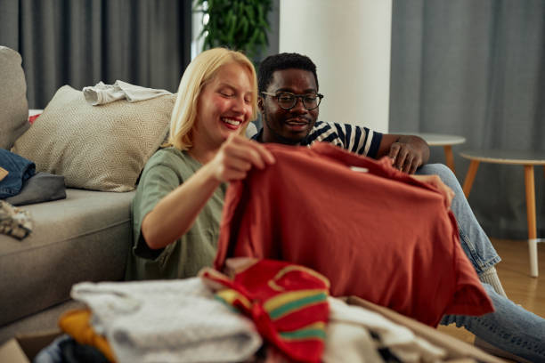 istock Couple donating some of their old clothes 1349372420
