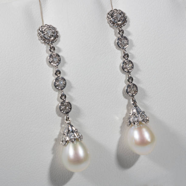 istock Long earrings in white gold, pearls and diamonds 1349373764