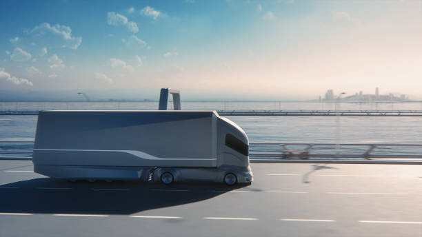 istock Futuristic Technology Concept: Autonomous Self-Driving Truck with Cargo Trailer Drives on the Road with Scanning Sensors. 3D Zero-Emissions Electric Lorry Driving Fast on Scenic Highway Bridge. 1349375137