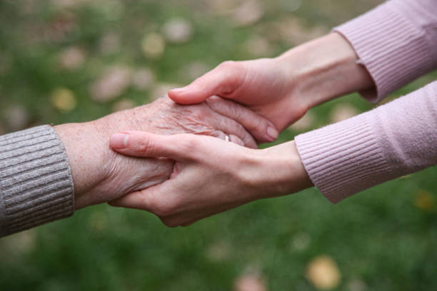 istock Helping hands. The concept of care for the elderly 1349376171