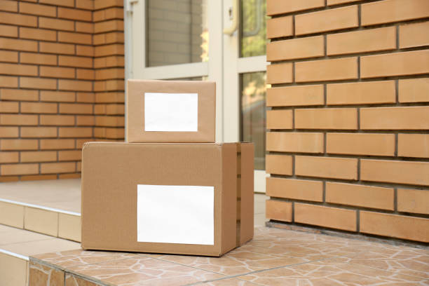 istock Delivered parcels on porch near front door 1349380415