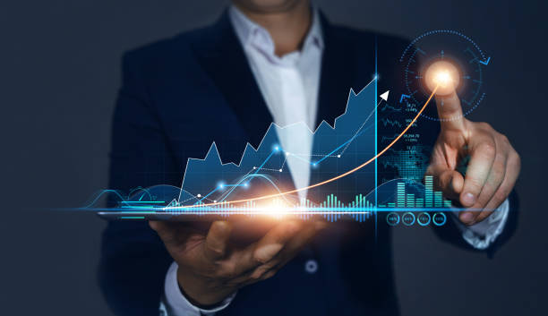 Businessman Holding Tablet and draws  Growing Virtual Hologram of Statistics, Graph and Chart. Business Strategy Development and Growing Growth Plan. Businessman Holding Tablet and draws  Growing Virtual Hologram of Statistics, Graph and Chart. Business Strategy Development and Growing Growth Plan efficiency photos stock pictures, royalty-free photos & images