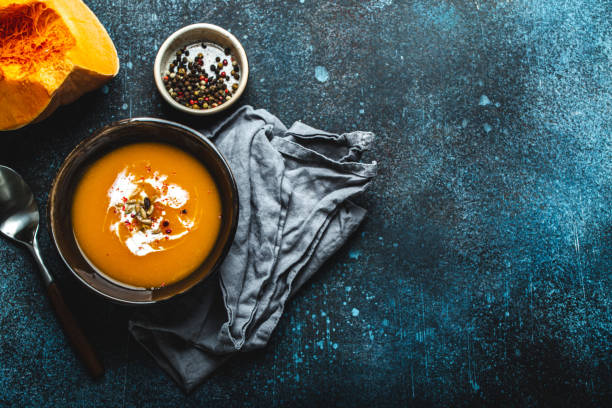 istock Pumpkin soup in bowl copy space 1349381979