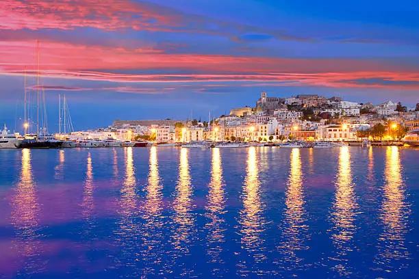 Ibiza island night view of Eivissa town and sea lights reflection