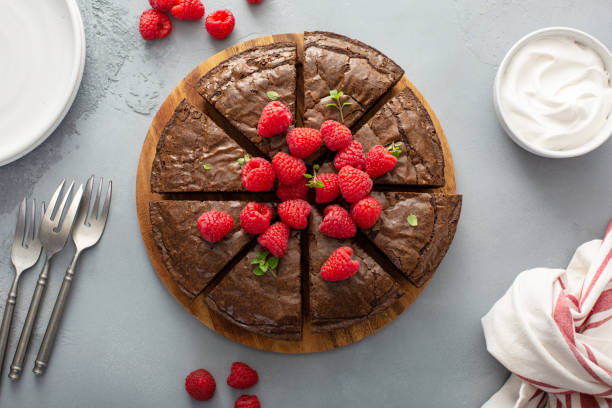 istock Brownie cake topped with fresh raspberries 1349383227