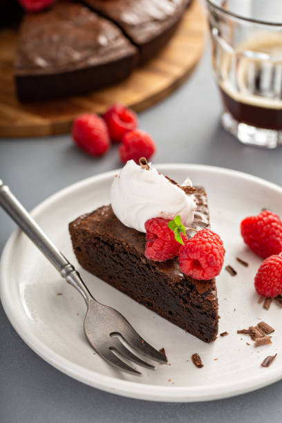 istock Brownie cake topped with fresh raspberries 1349383232