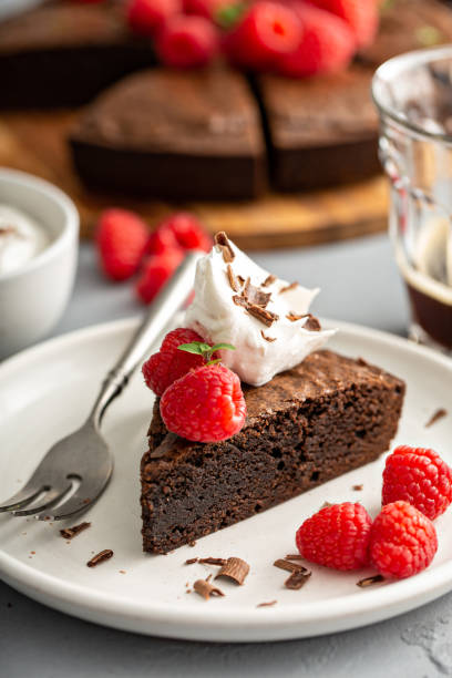 istock Brownie cake topped with fresh raspberries 1349383237
