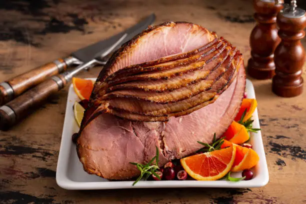 Christmas or Easter spiral sliced ham with oranges and cranberries