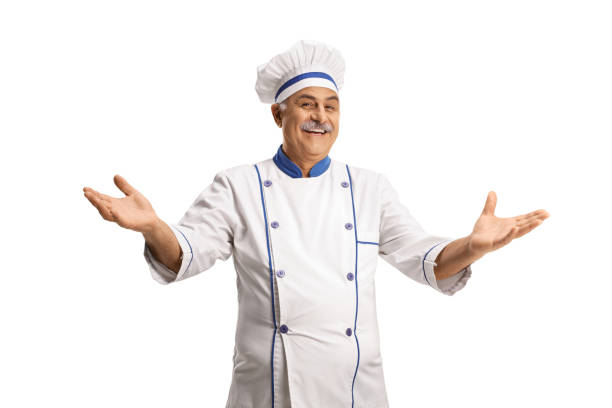 istock Cheerful mature cook smiling and gesturing with hands 1349384447