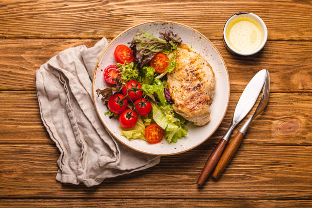 istock Healthy salad with grilled chicken breast top view 1349387530