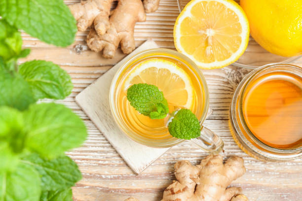 istock Cup of tea with lemon, ginger root and mint 1349389370