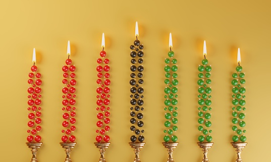 Red, green and black candles with ornaments flat lay, symbolizing Kwanzaa concepts. ( 3d render )