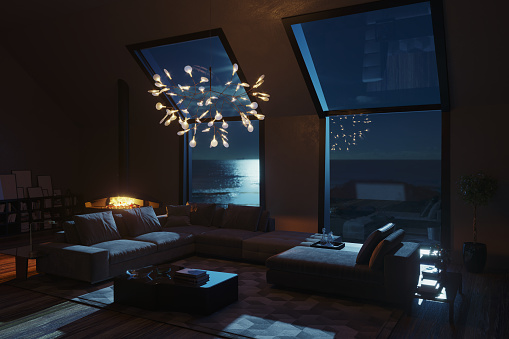 Beach House Interior living room at Seashore with beautiful sea view at night. (3d render)