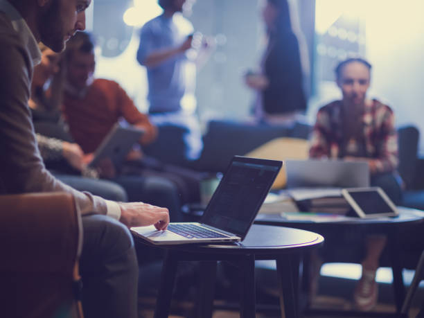 istock businessman using laptop, concentrated employee analyzing project results, watching webinar or distance staff training 1349397508