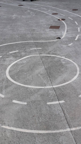 istock Lane painted with white paint on gray floor 1349398500