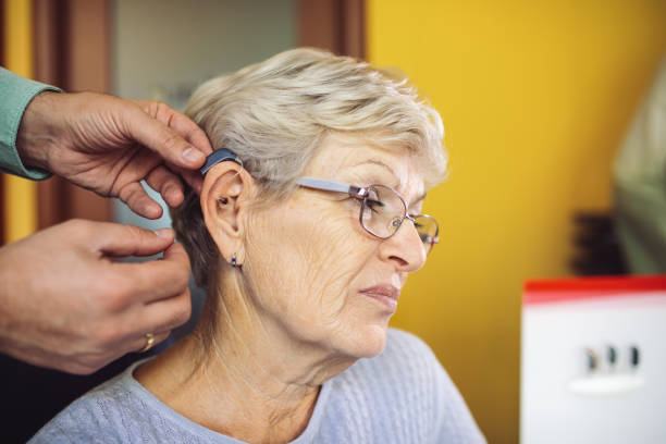 istock Hearing test and buying hearing aid 1349405750