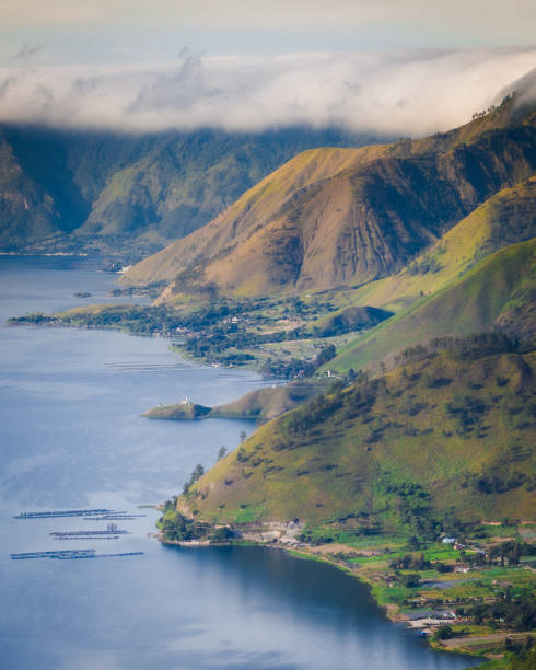 Lake Toba Lake Toba is one of the biggest lake in the World. Located in North Sumatera, Indonesia. This lake is so beautiful and the peoples who lives arround the lake are so welcome lake toba indonesia stock pictures, royalty-free photos & images