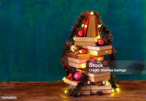 Giving Books For Christmas With Stack Of Books Forming A Christmas Treereading Literature Education Gift Present Christian Holiday Concept Stock Photo - Download Image Now